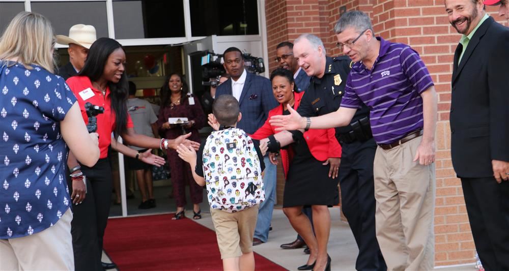  Student greeted as he enters school